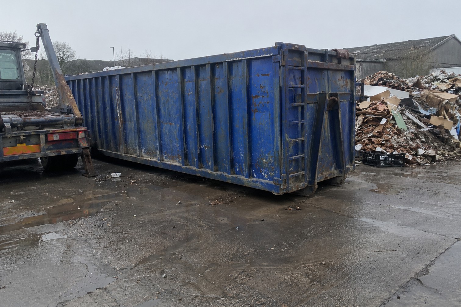 Blue 20-yard roll-on roll-off skip on a waste yard in the Scarborough area